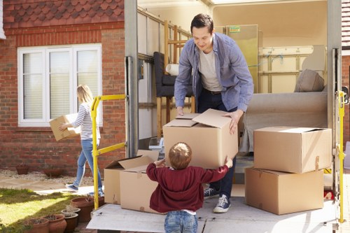 Removal van loading household furniture in a German city street