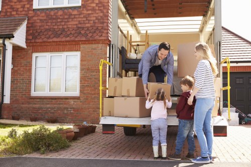 Moving crew handling furniture in an apartment building