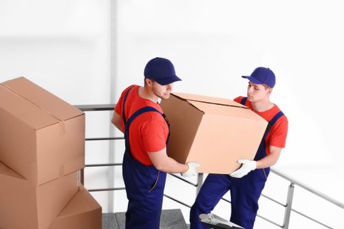 Removal team preparing moving items safely before transport