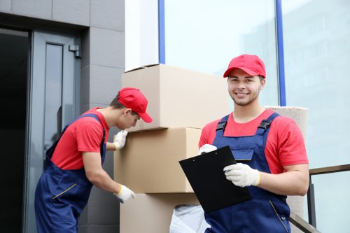House removal team preparing a move in a German city apartment