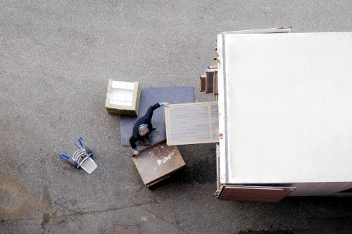 Staff using proper lifting techniques during a removal job