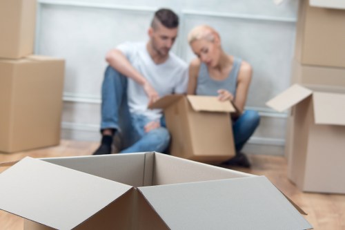 Packed moving boxes and furniture ready for transport