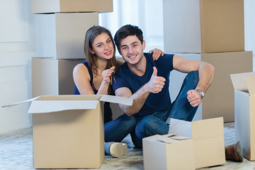 Removal team preparing furniture and household goods for transport