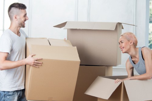 Trained movers handling furniture carefully inside a property