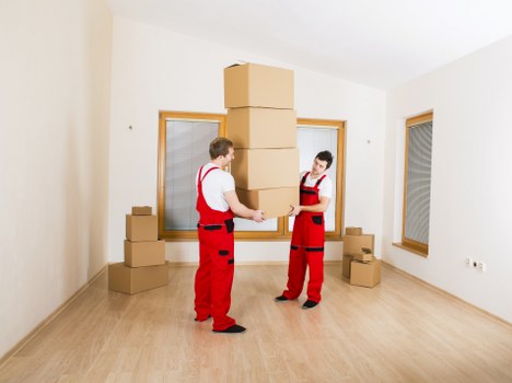 Packed office equipment and furniture ready for transport
