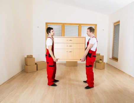 Packing boxes and household items into a moving van