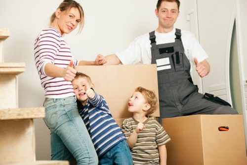 Moving team navigating stairs in a German Altbau building