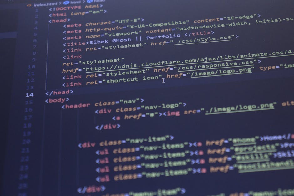 Close-up view of a computer screen displaying a blurred and colorful array of programming code in various languages, including JavaScript, HTML, and CSS. The code features syntax highlighting with key